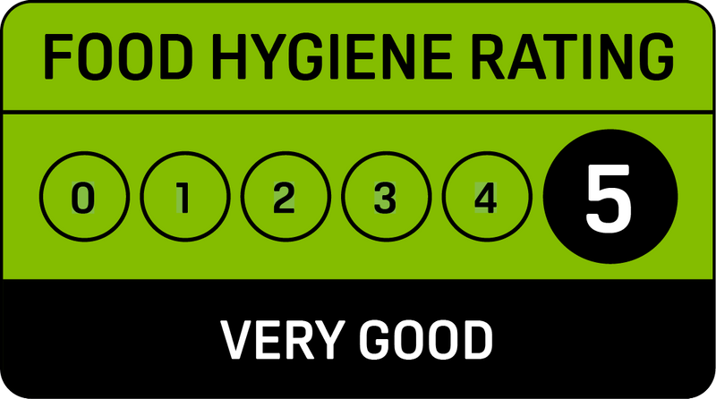 A green and black sign that says food hygiene rating good Gingerbread
