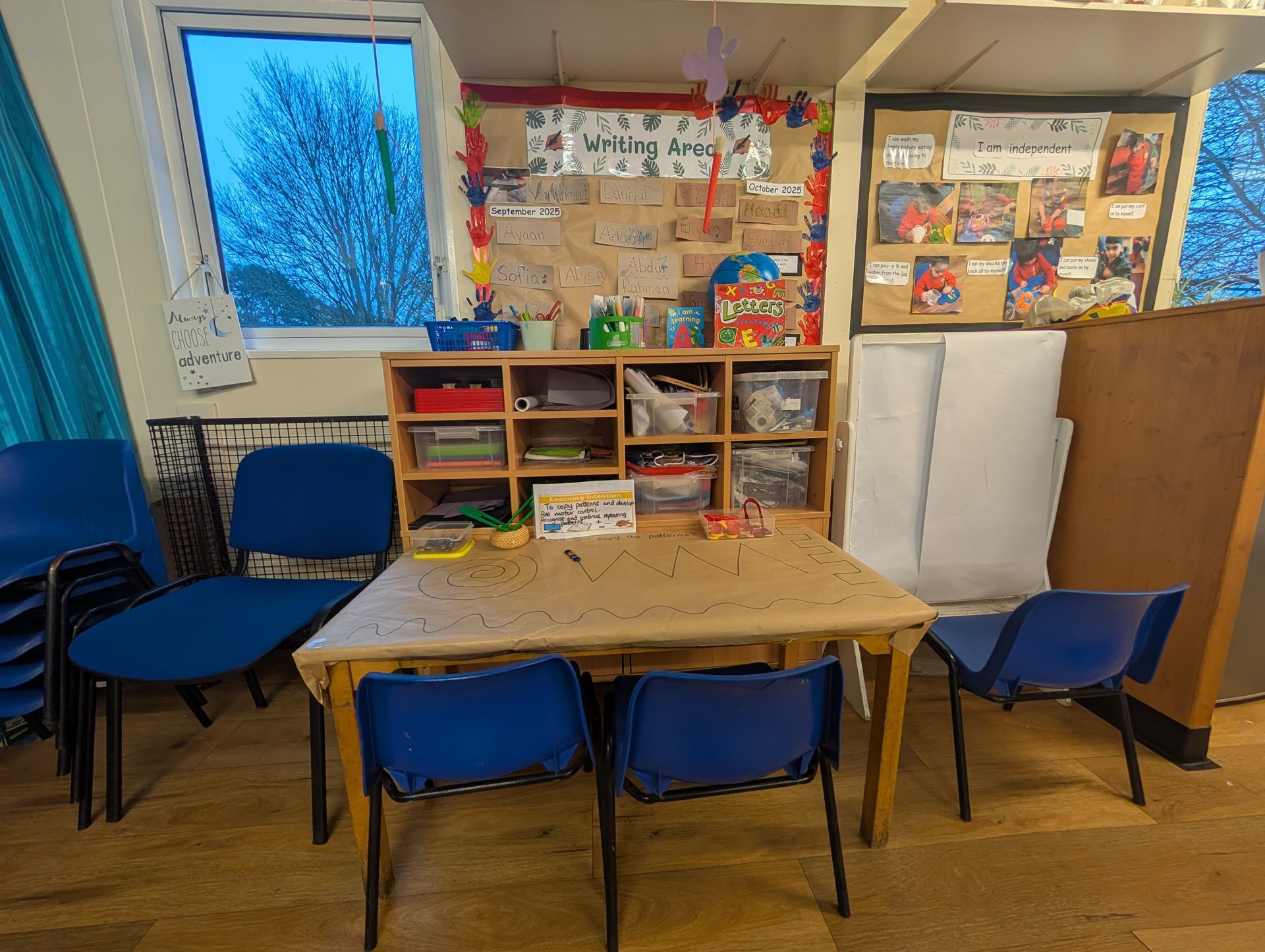 activity table and blue chairs at gingerbread cottage playgroup

