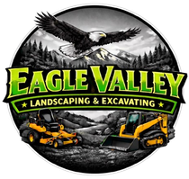 Logo for Eagle Valley Landscaping & Excavating featuring an eagle flying over mountains, a lawnmower, and a skid steer.