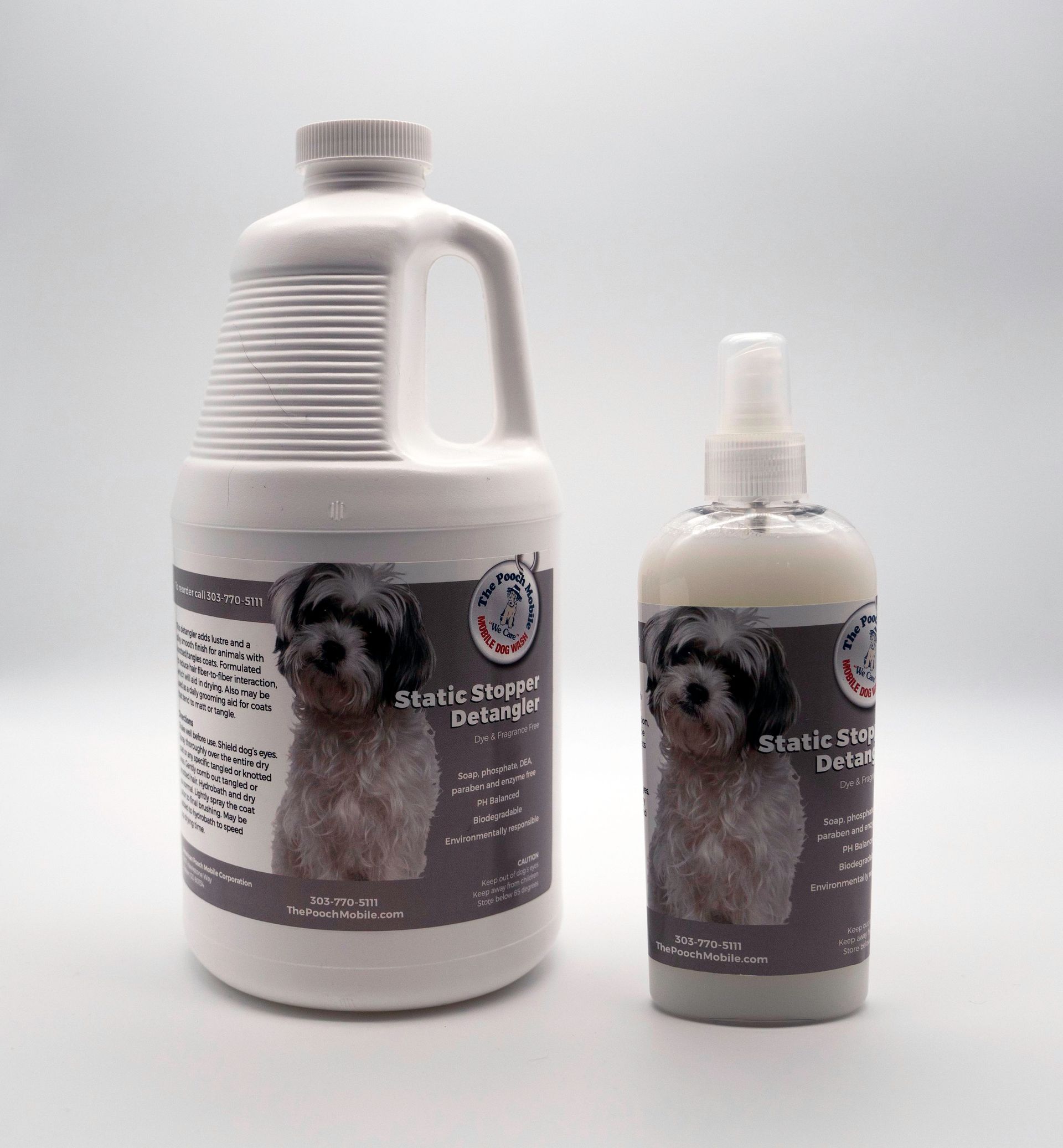 A gallon and a spray bottle of dog shampoo