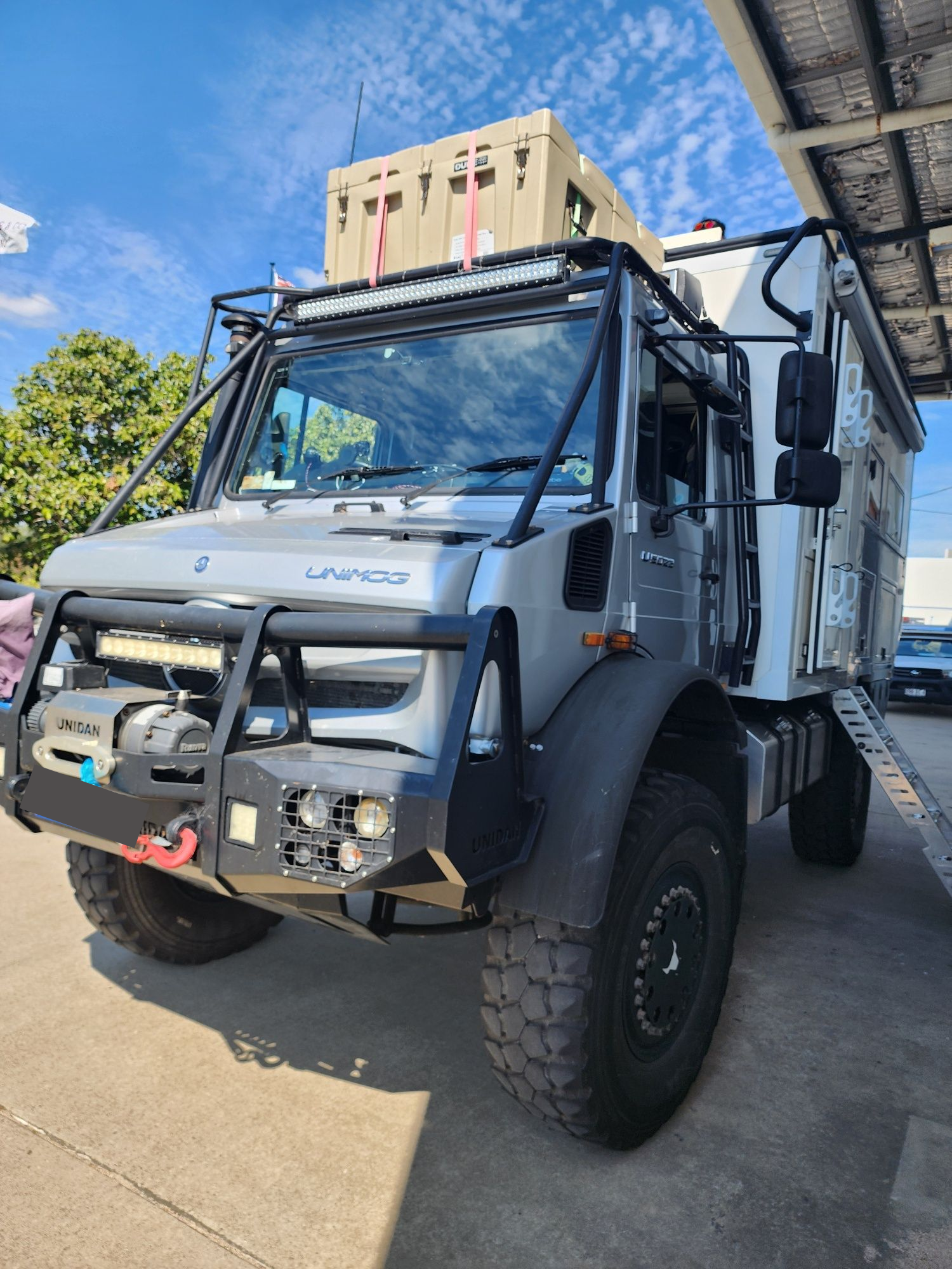 A Row Of Trucks Are Parked In A Parking Lot — Australian Specialised Machinery Glass In Mount Louisa, QLD