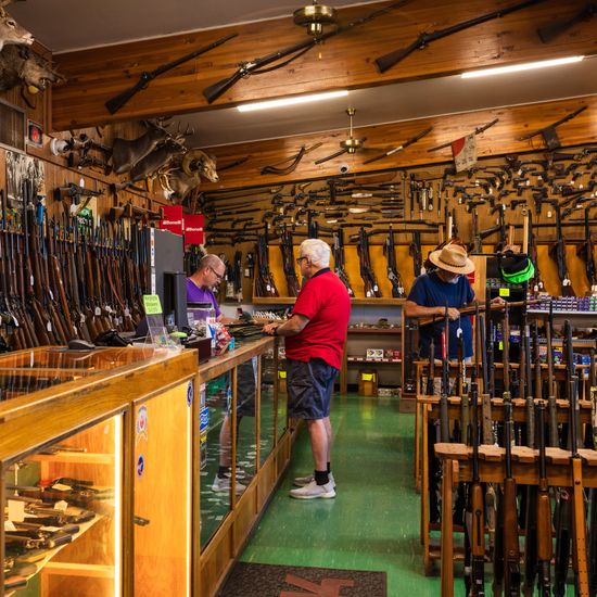 Man Holding a Pistol on Shop — Tucson, AZ — Murphy's Guns And Gunsmithing