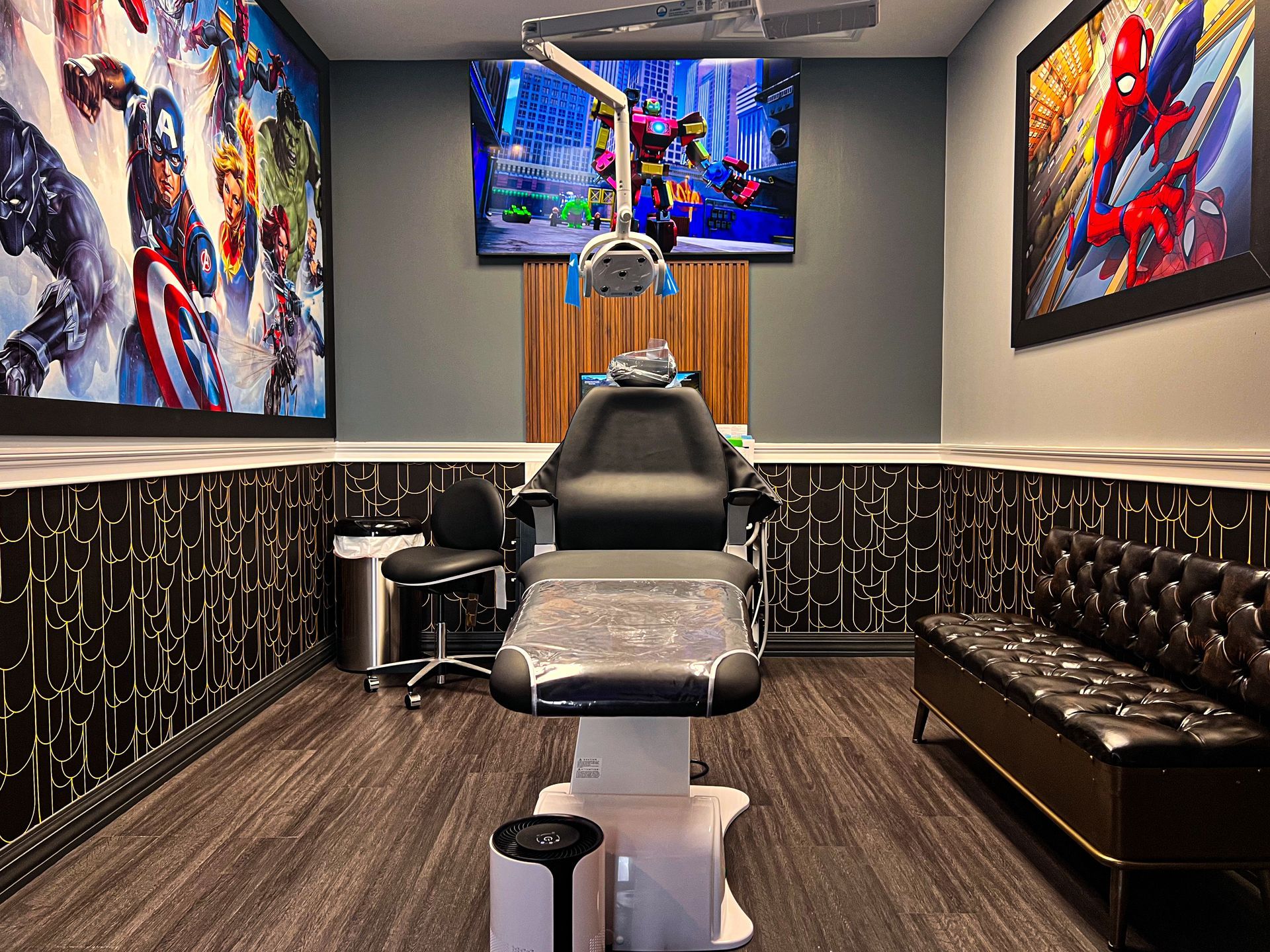 Modern tattoo studio with a central chair, Spider-Man wall art, and dark wood flooring