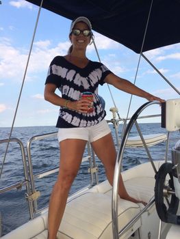 Woman at the helm of a sail boat | Tiny house DC