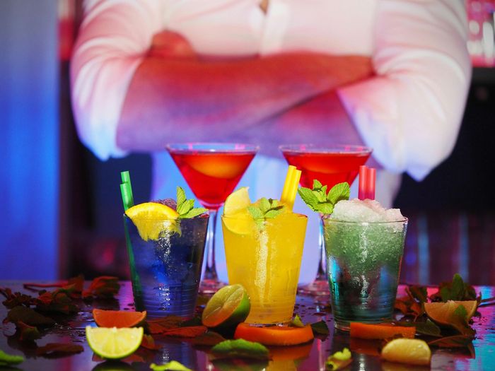 Fine dining cocktails with bartender in the background | DC condos for sale