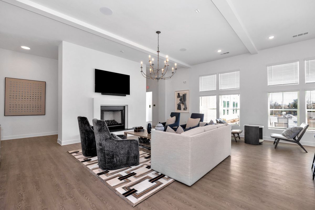 Bright, modern living room with fireplace, white walls, and contemporary furniture.