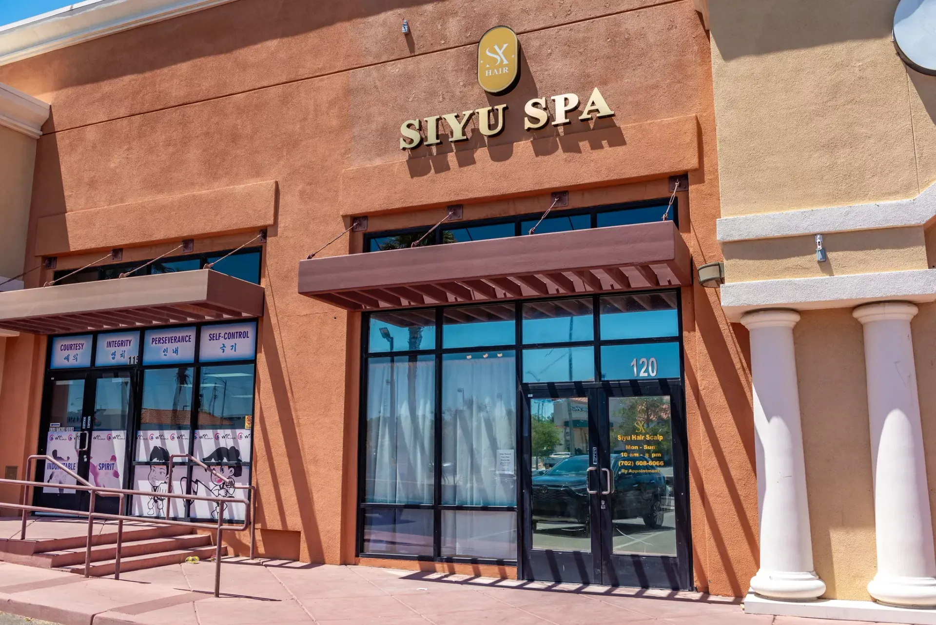 Tan-colored storefront with the sign 