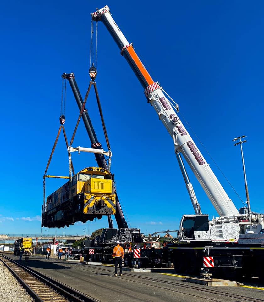 A Large Crane is Lifting a Train on a Sunny Day — East Coast Cranes in Port Macquarie, NSW
