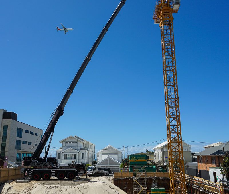 A Crane and a Tower Crane at a Construction Site — East Coast Cranes in Ormeau, QLD