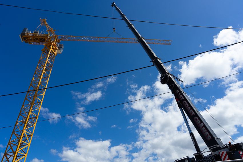 A Crane is Being Used to Lift a Large Object in the Sky — East Coast Cranes in Cairns, QLD
