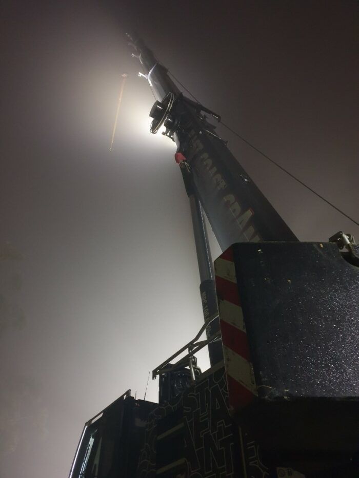 Crane Reaching Into Foggy Sky at Night — East Coast Cranes in Ormeau, QLD