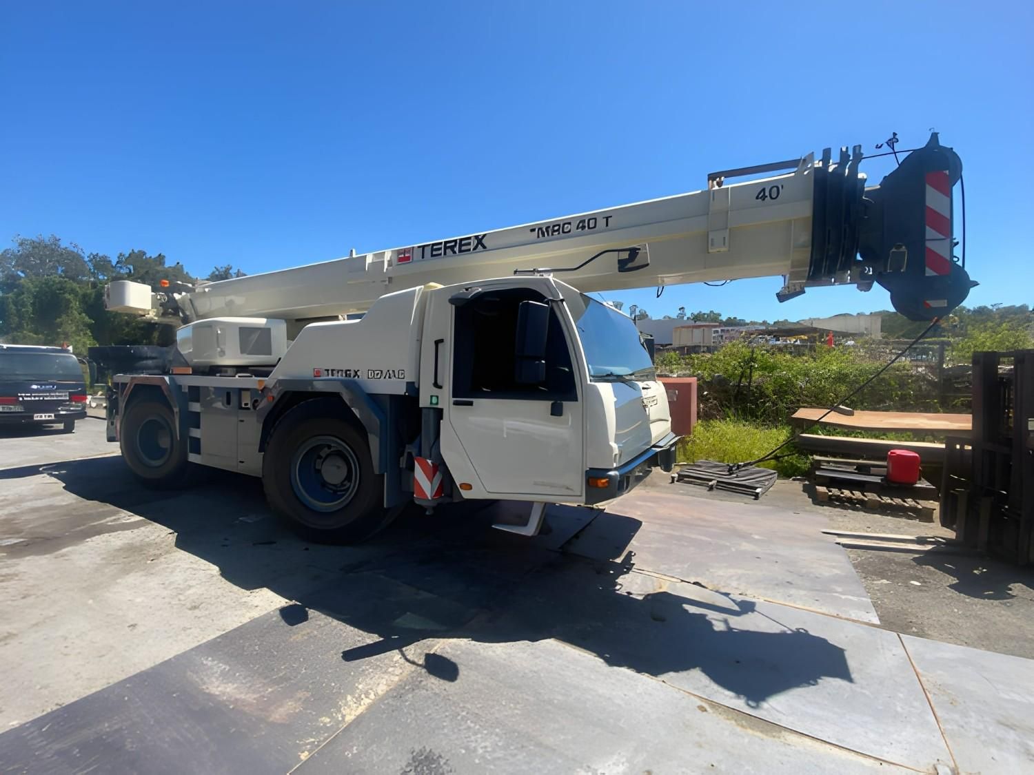 A White Terex Crane Parked Outdoors on a Sunny Day, Boom Extended — East Coast Cranes in Rockhampton, QLD