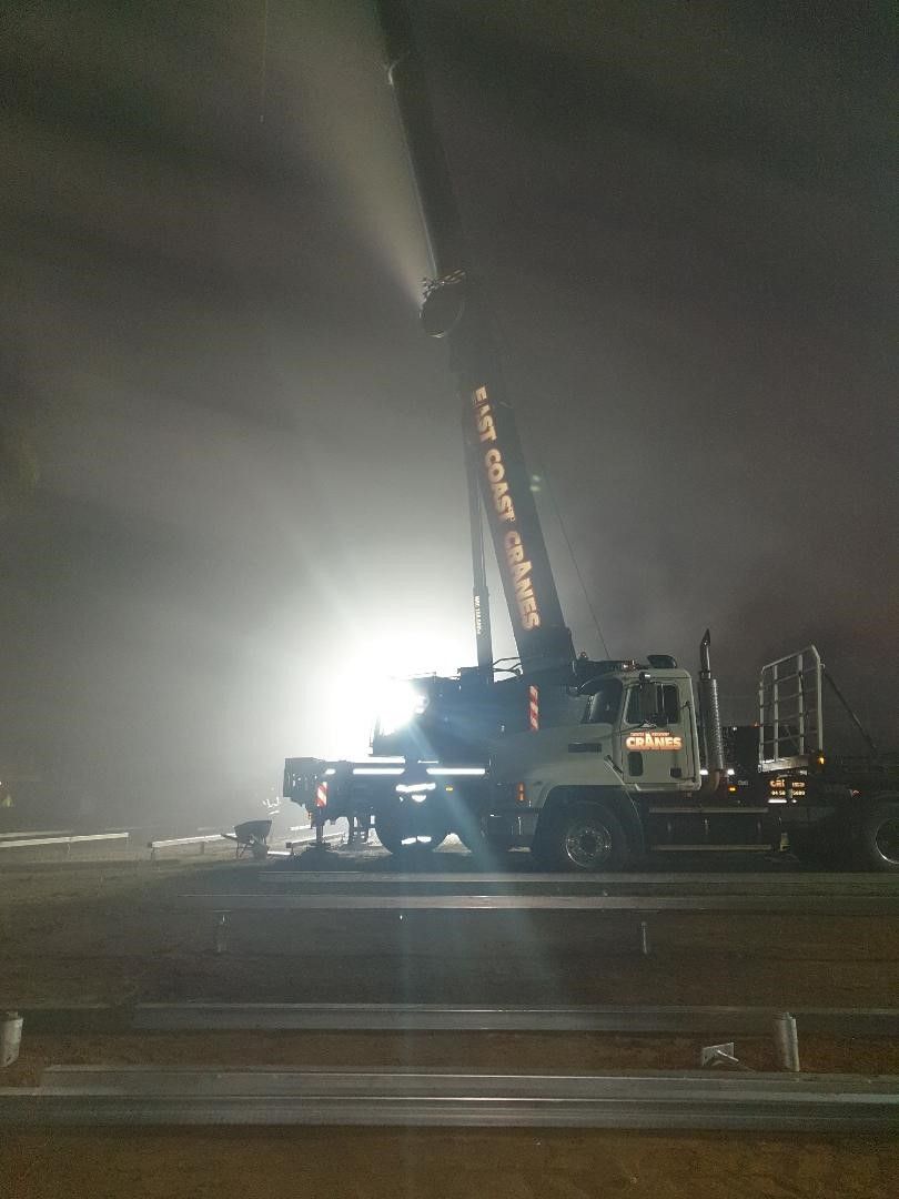 Fire Truck With Extended Ladder Spraying Water Into Smoke at Night — East Coast Cranes in Ormeau, QLD