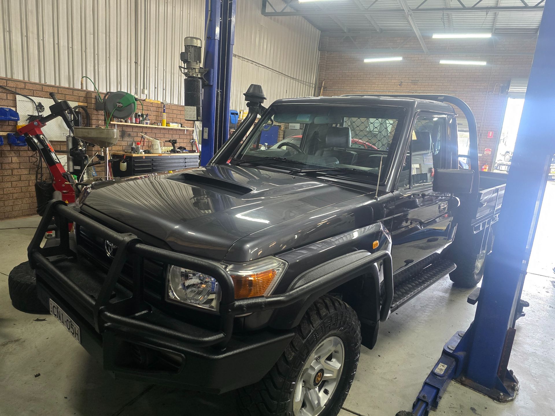 Grey Pickup Truck With a Front Grille Guard