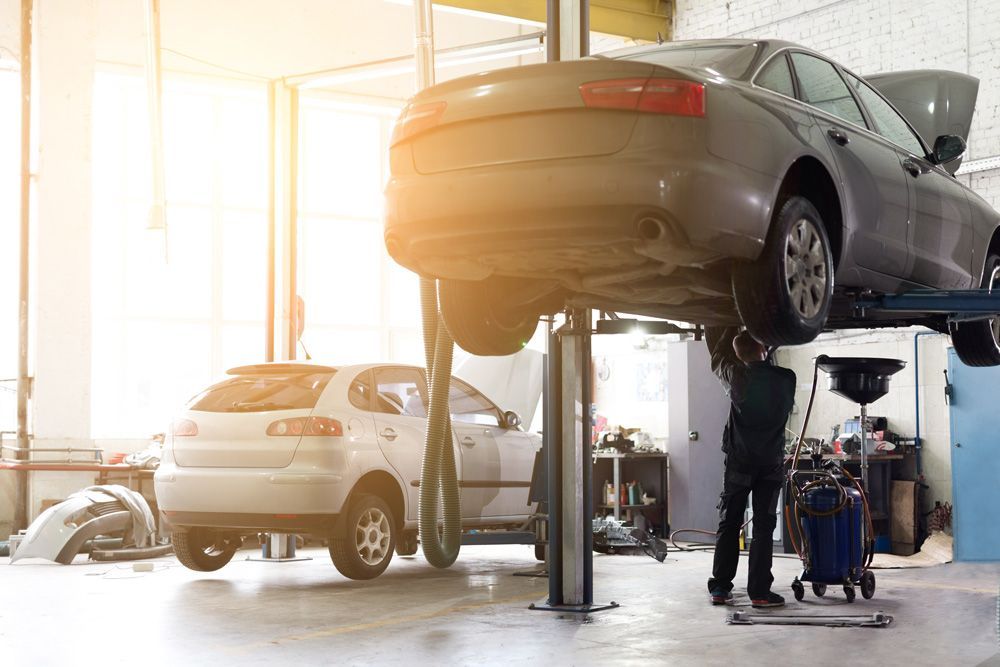 Mechanic Servicing a Car in A Garage