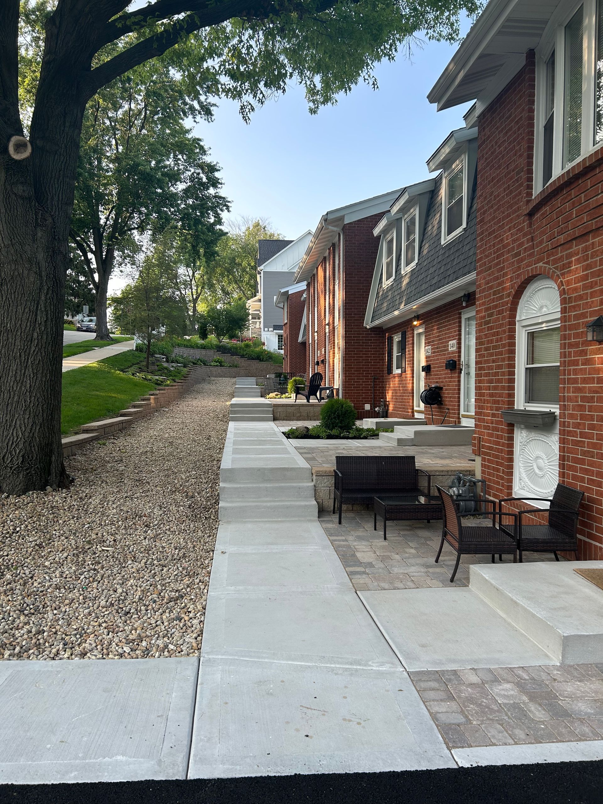 a brick building with a patio in front of it