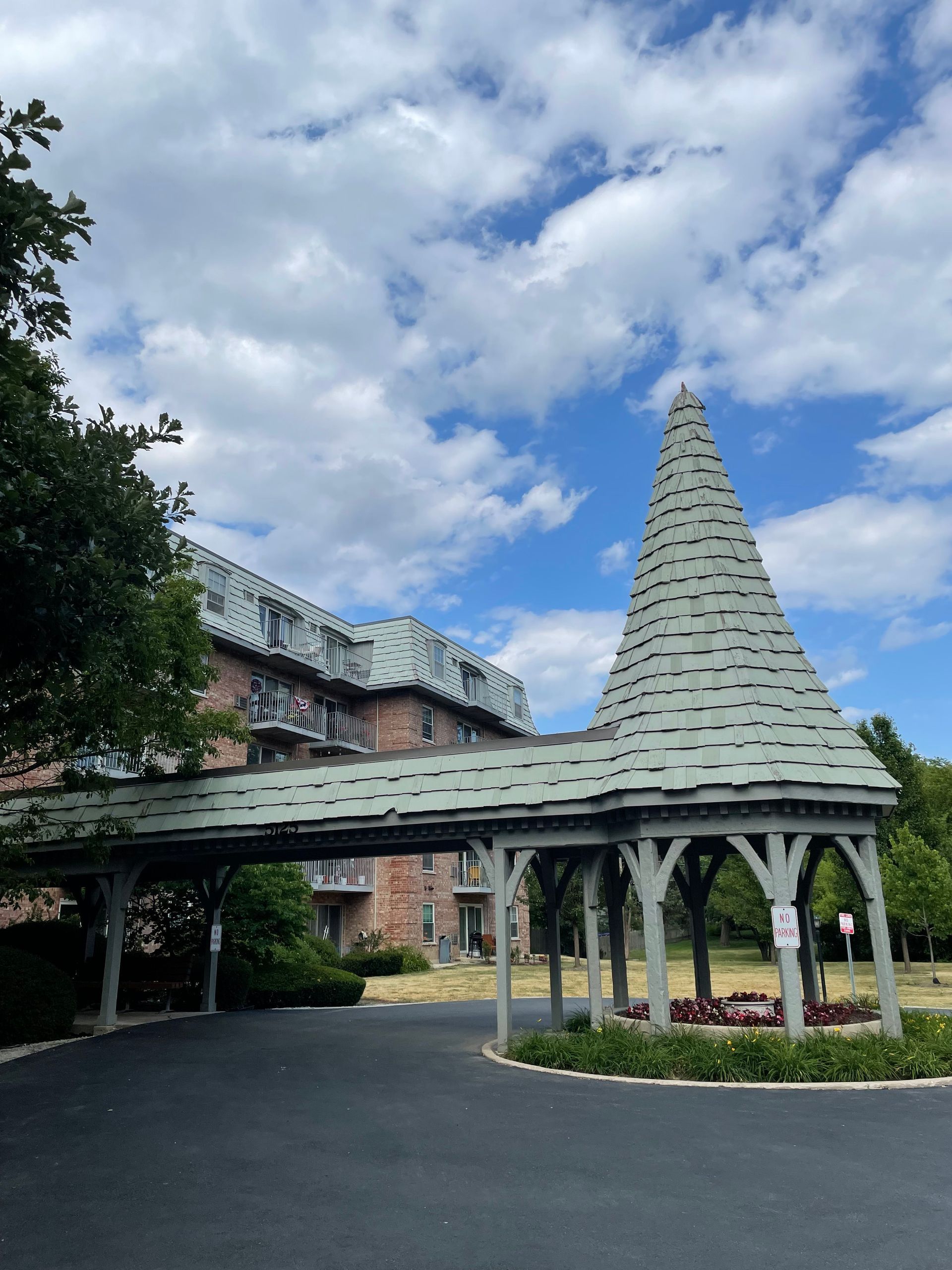 a large building with a covered walkway leading to it