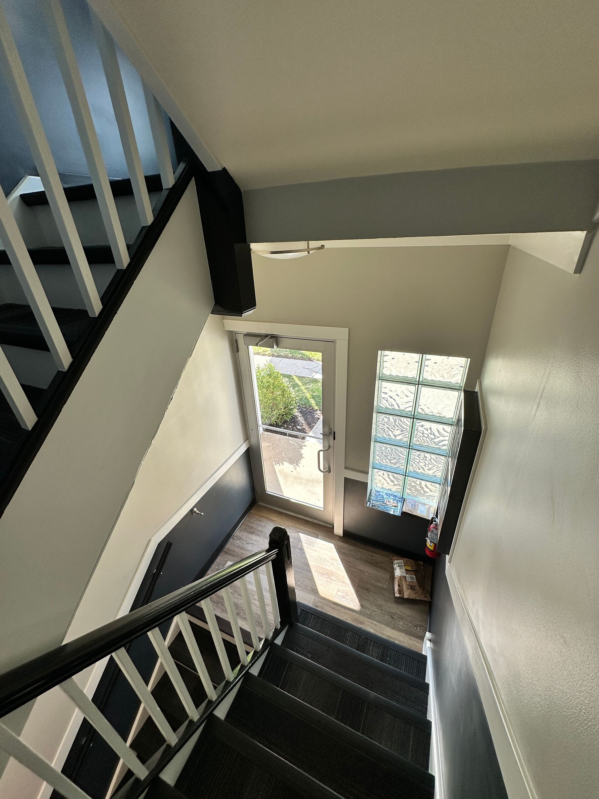 an aerial view of a staircase leading up to a door .