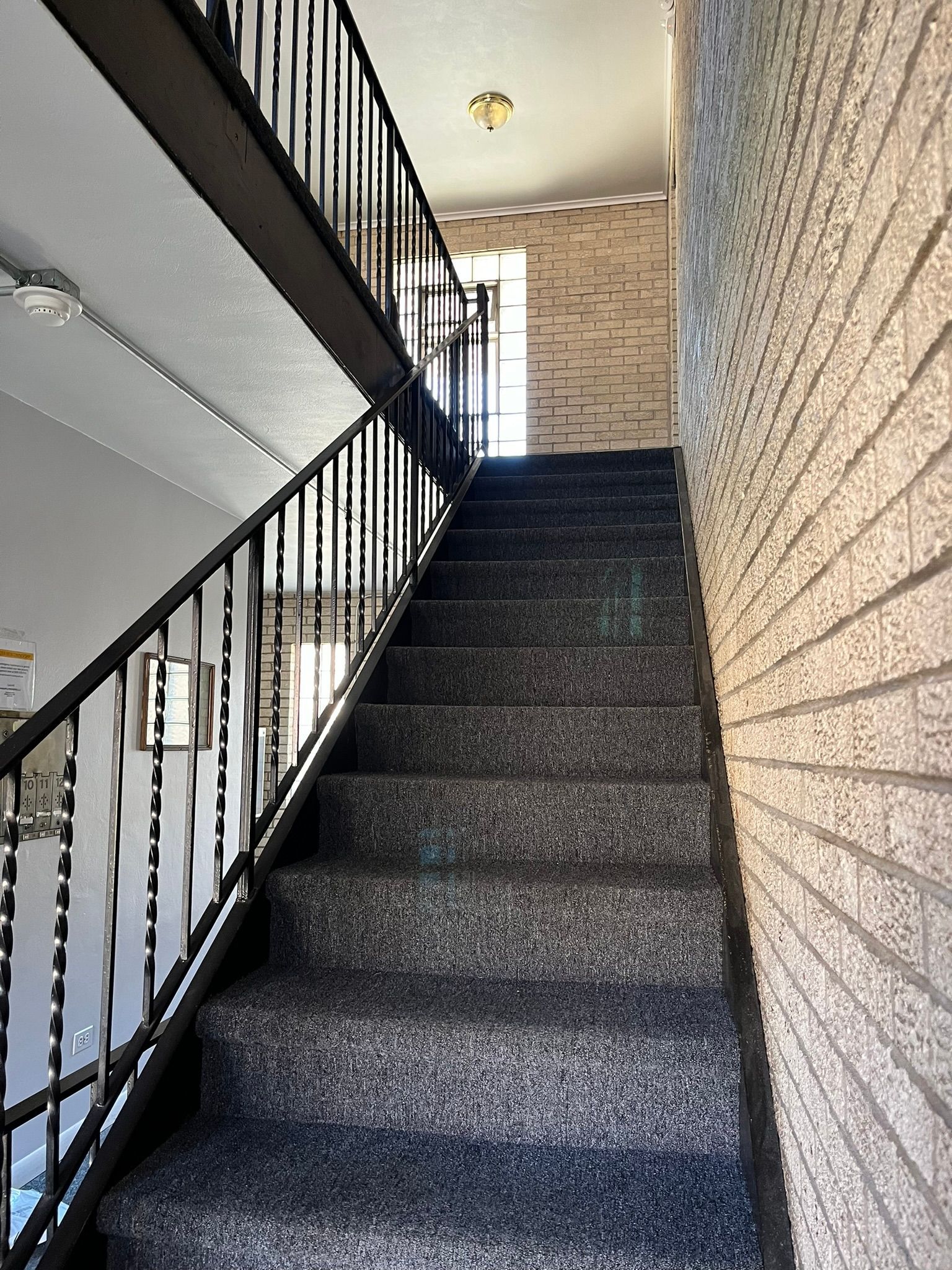 a set of stairs leading up to the second floor of a building .