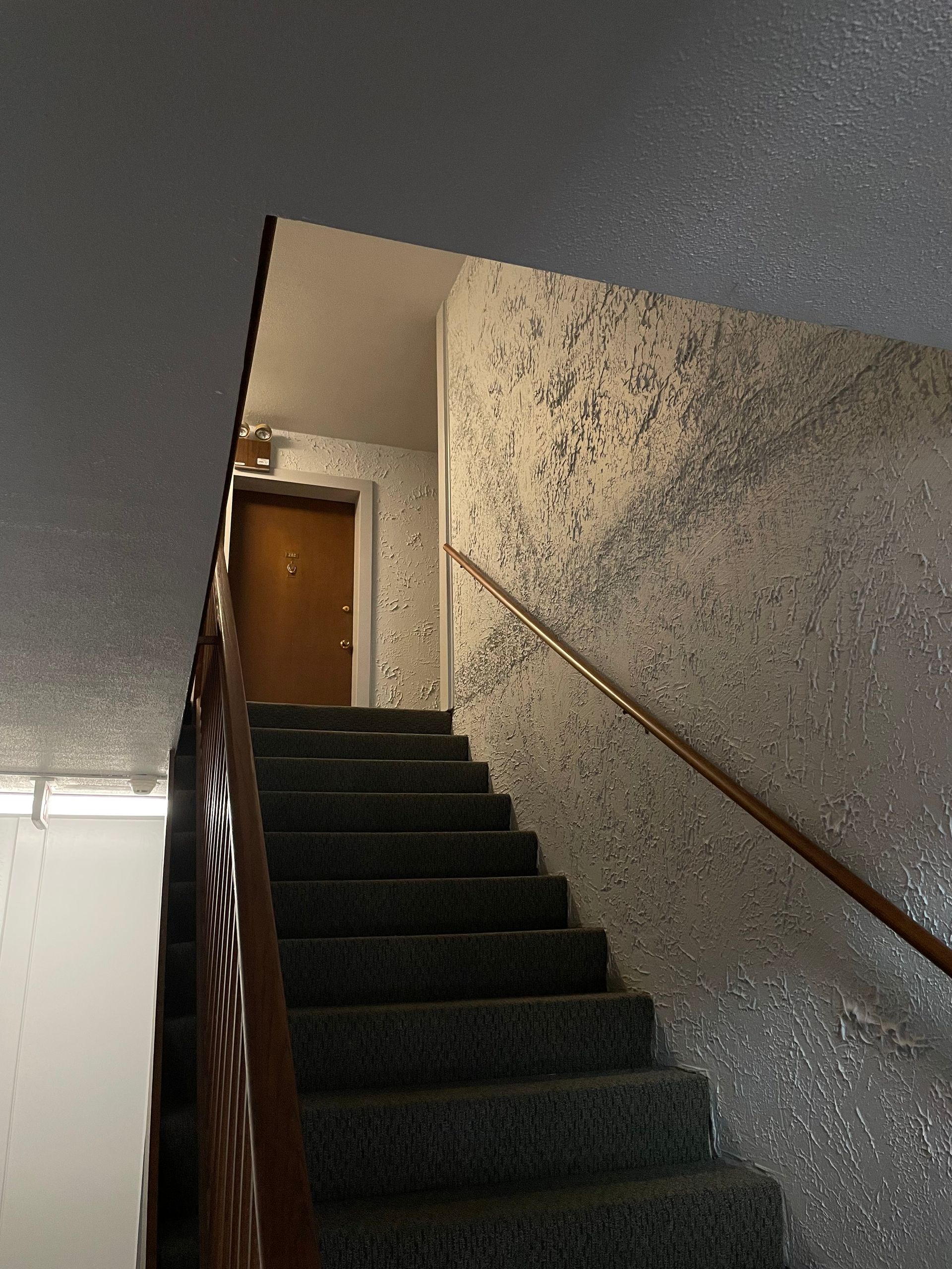 a set of stairs leading up to a door in a building