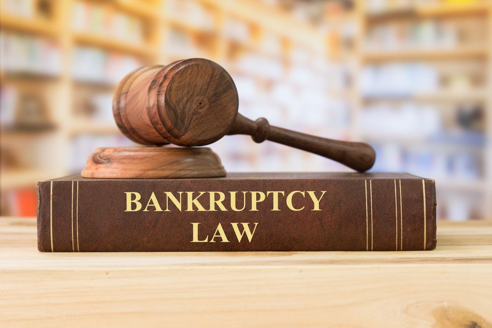 Bankruptcy law book with gavel on top