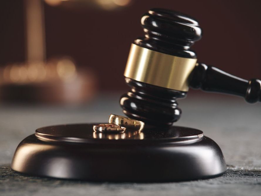 Wedding rings on judge gavel