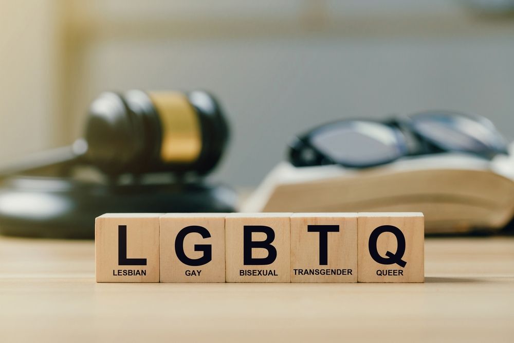 wooden blocks LGBTQ on judge gavel