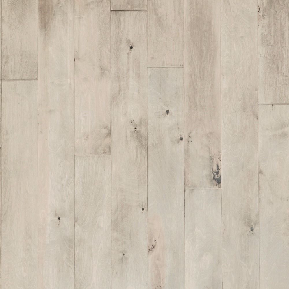 Light-colored hardwood flooring with visible wood grain and knots. Vertical planks with varying tones.