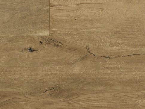 Close-up of light brown hardwood flooring with wood grain and dark knots.