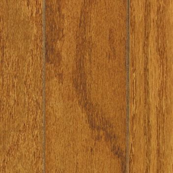 Close-up of hardwood flooring planks in shades of brown, with visible wood grain.