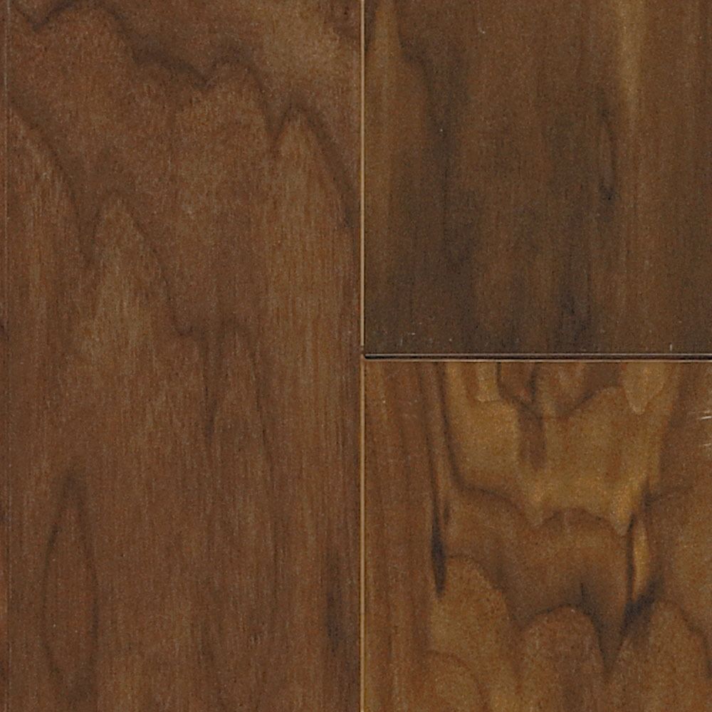Close-up of brown hardwood flooring. The planks display natural wood grain patterns and variations in color.