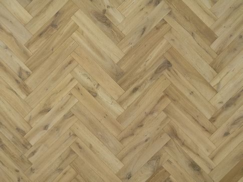 Herringbone pattern wood flooring. Light brown planks with a natural wood grain texture.
