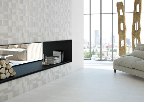 Modern living room with fireplace, white walls, and city view.