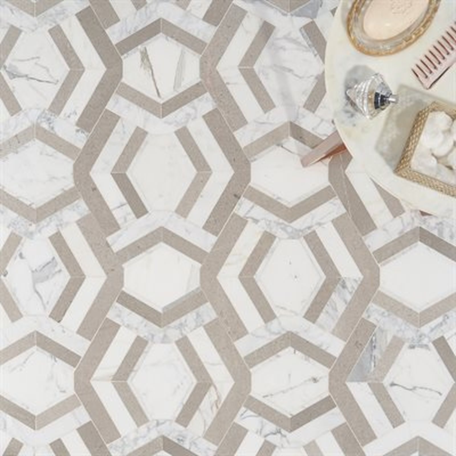 Geometric patterned floor tiles in white and beige with small round table.