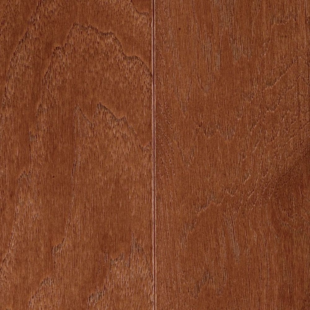 Close-up of wooden floorboards; warm brown color with visible wood grain and vertical seams.