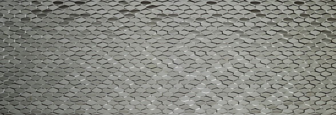 Close-up of a textured, speckled gray surface.