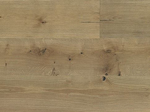 Light brown wood flooring with knots and grain detail.
