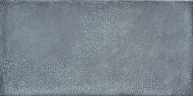 Gray rectangular tile with subtle geometric pattern and textured finish.