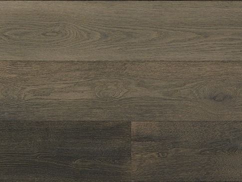 Close-up of dark brown wood flooring with prominent grain patterns.