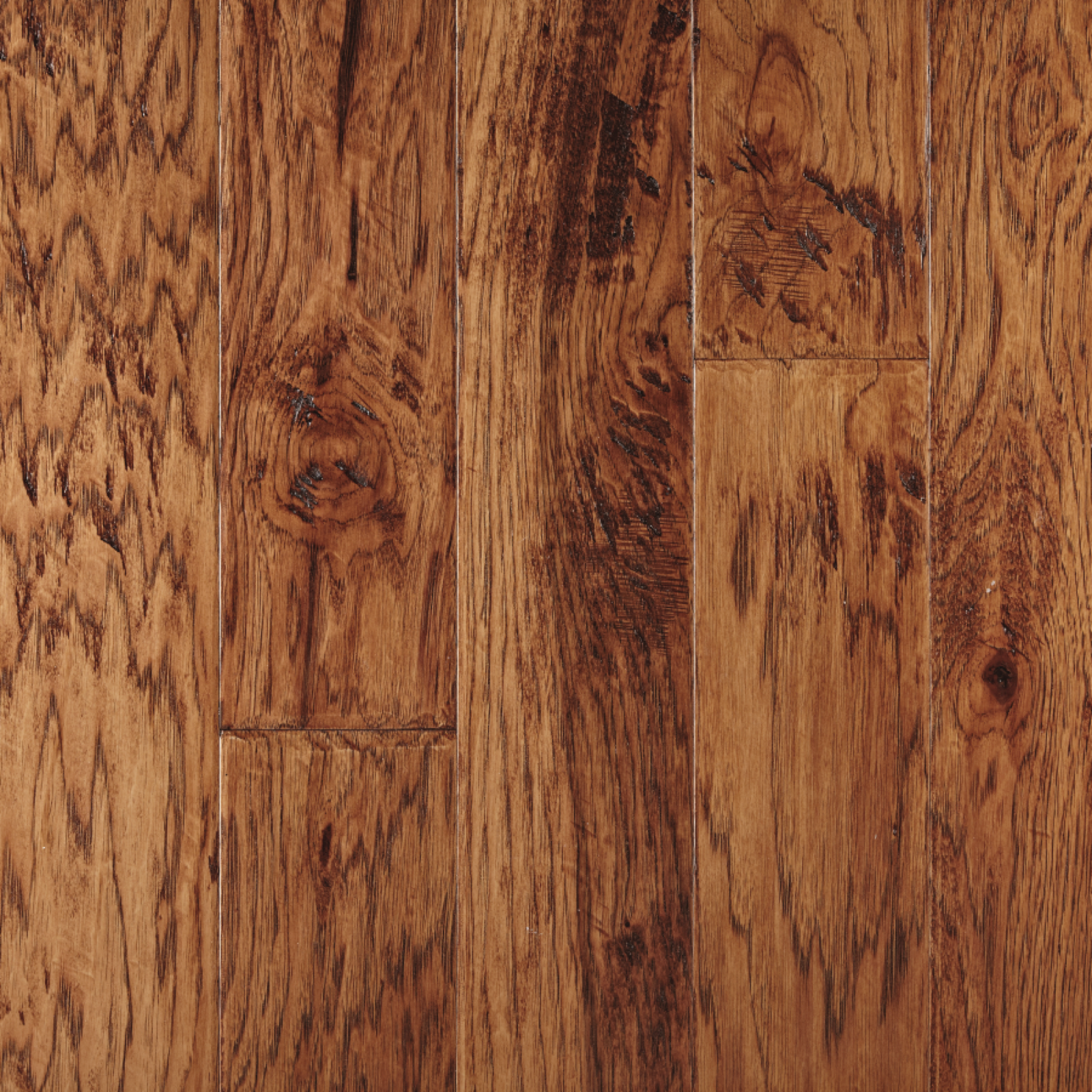 Close-up of hardwood flooring; brown tones with wood grain and knots.