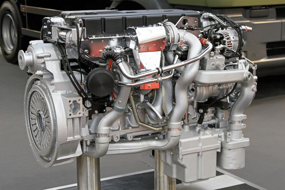 A Model of A Diesel Engine with A Truck in The Background — Top End Diesel In Katherine, NT
