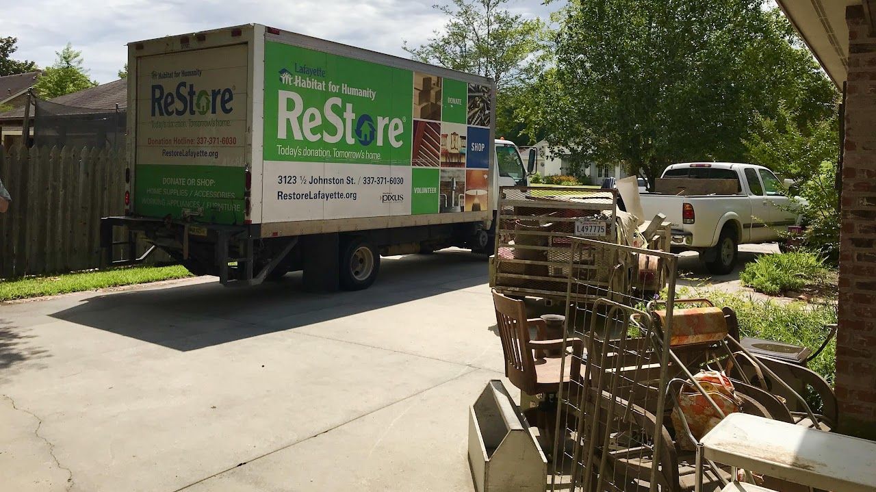 Lafayette Habitat for Humanity ReStore truck picking up donations for Amazing Spaces declutter project.