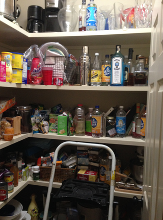 A pantry filled with lots of food and drinks including schweppes