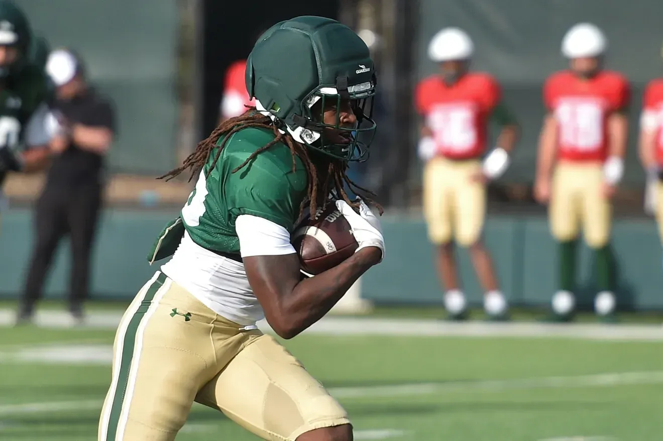 Damian Moore Jr. in his number 12 jersey on the field
