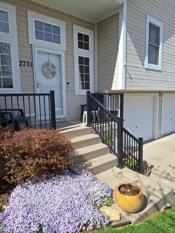 A house with stairs leading up to the front door
