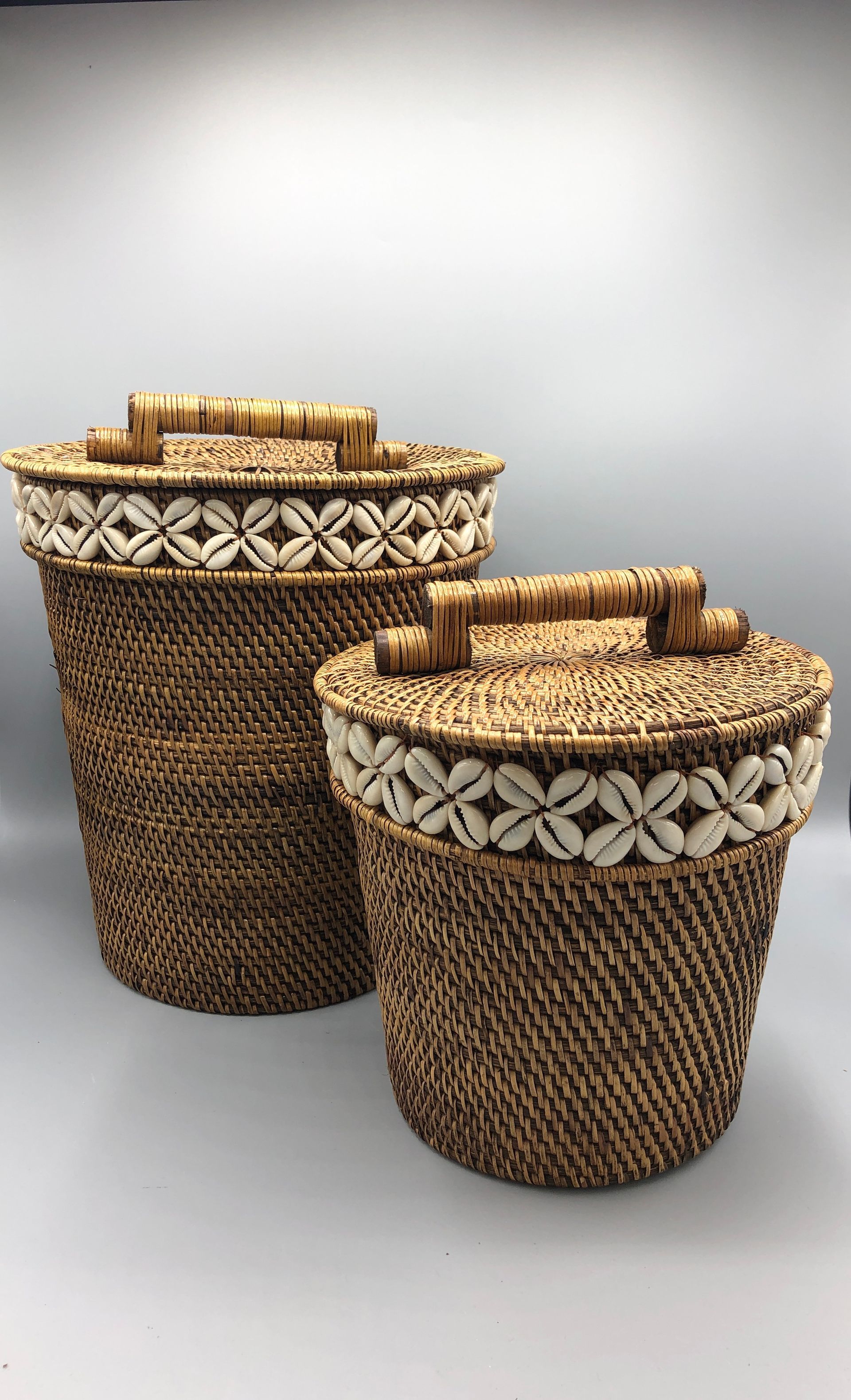Two Cylindrical, Dark-brown Woven Baskets — Tropic Living in Palm Cove, QLD