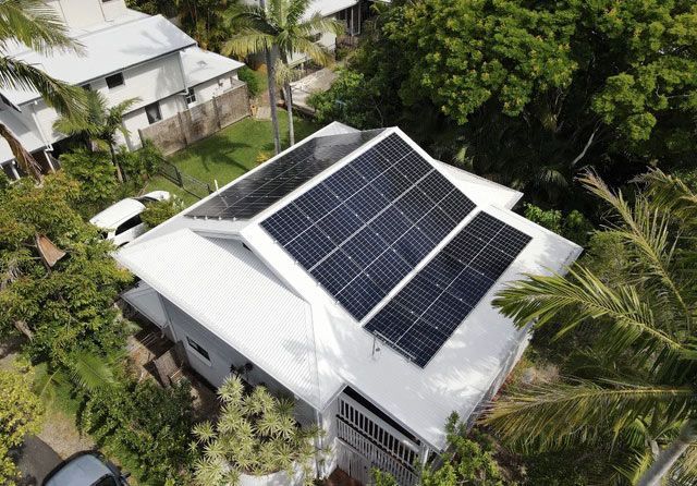 An Aerial View Of A House With Solar Panels On The Roof — All Roof Restorations & Solar In Lismore, NSW