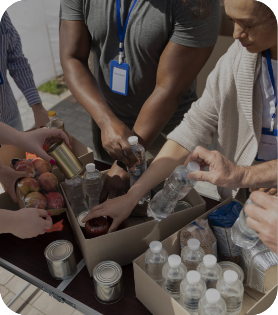 Group of people packing food pantry boxes - Mosaic Church, Freeport, FL