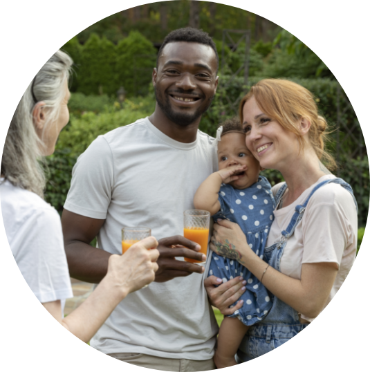 Interracial couple holding a baby with another lady - Mosaic Church, Freeport, FL