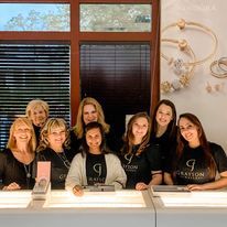 A group of women are posing for a picture in a store.
